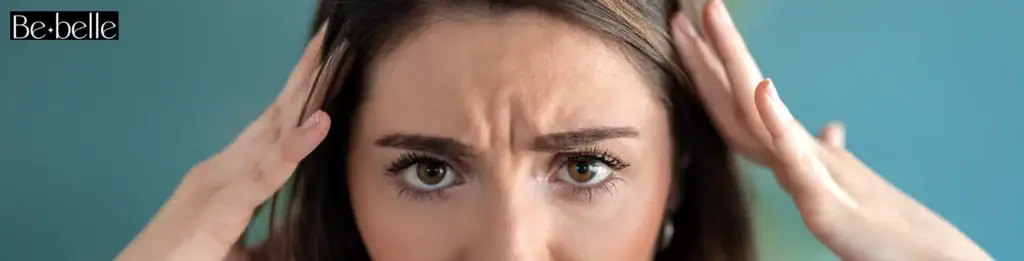 המחשה של קמטים בין הגבות או קמטי זעף/כעס עם לוגו Bebelle