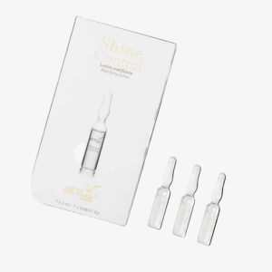 Shine Control של GERnétic - אריזת המוצר הלבנה לצד שלוש אמפולות שקופות